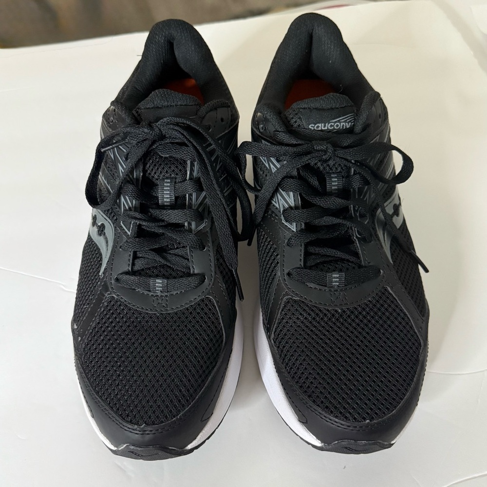 Saucony Black Sneakers with Breathable Mesh and Cushioned Sole